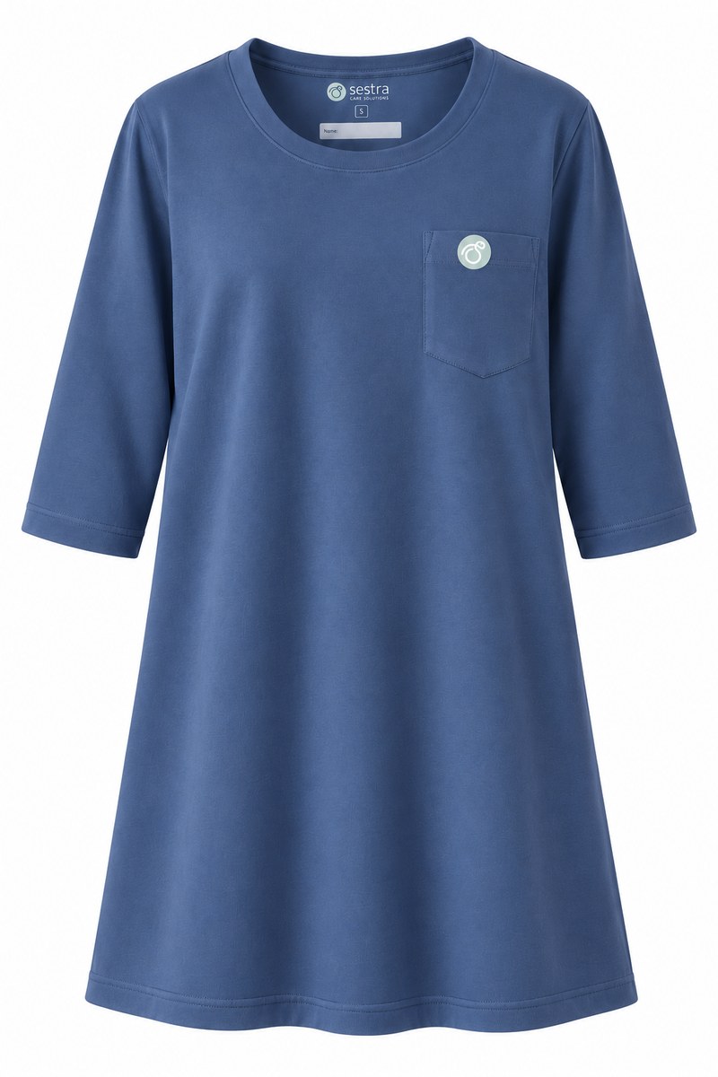 Pigeon Blue women's 3/4-sleeved adaptive care shirt with round neckline and circular Sestra Care logo on the chest pocket.